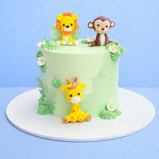 jungle themed childrens birthday cake in pale green with animal figurines delivered in london