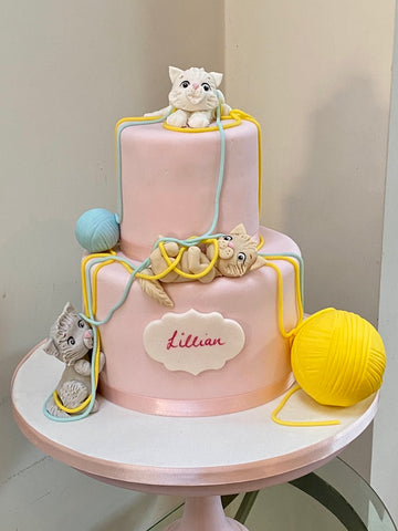 Kitten Birthday Cake playing with Wool - lots. of kittens and big balls of wool to decorate this pink two tier cake, so cute!