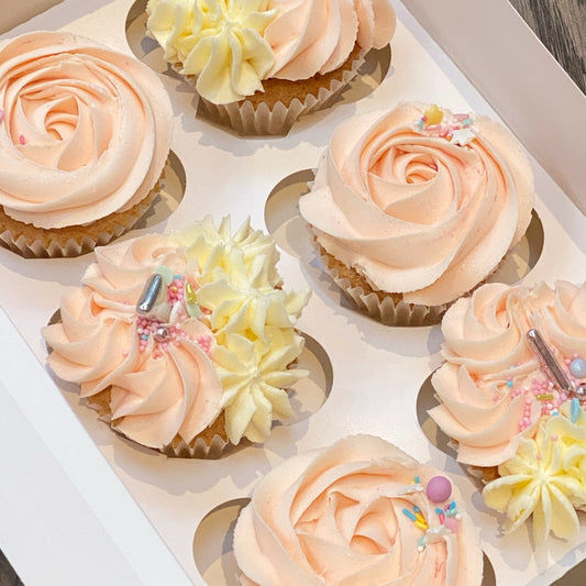 Pink and white decorative cupcakes with sprinkle decorations available to order in london