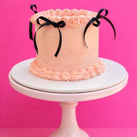 Pink lambeth piped vintage cake with black ribbon  delivered in london