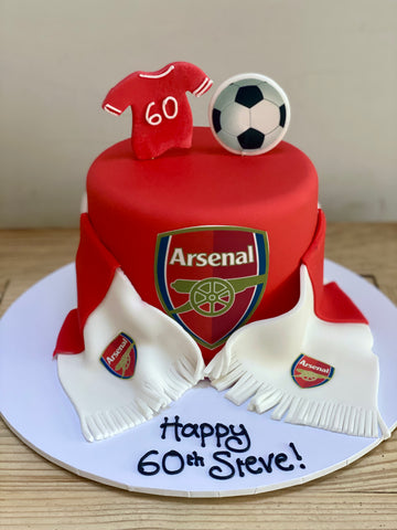 Red Arsenal-themed birthday cake with jersey, scarf, and soccer ball 
