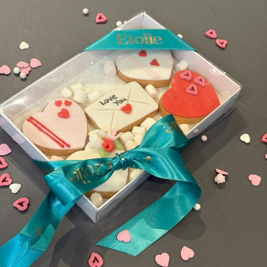 Box of five beautiful valentine cookies beautifully presented in a box and ribbon for postage across UK, part of our valentine cakes London range