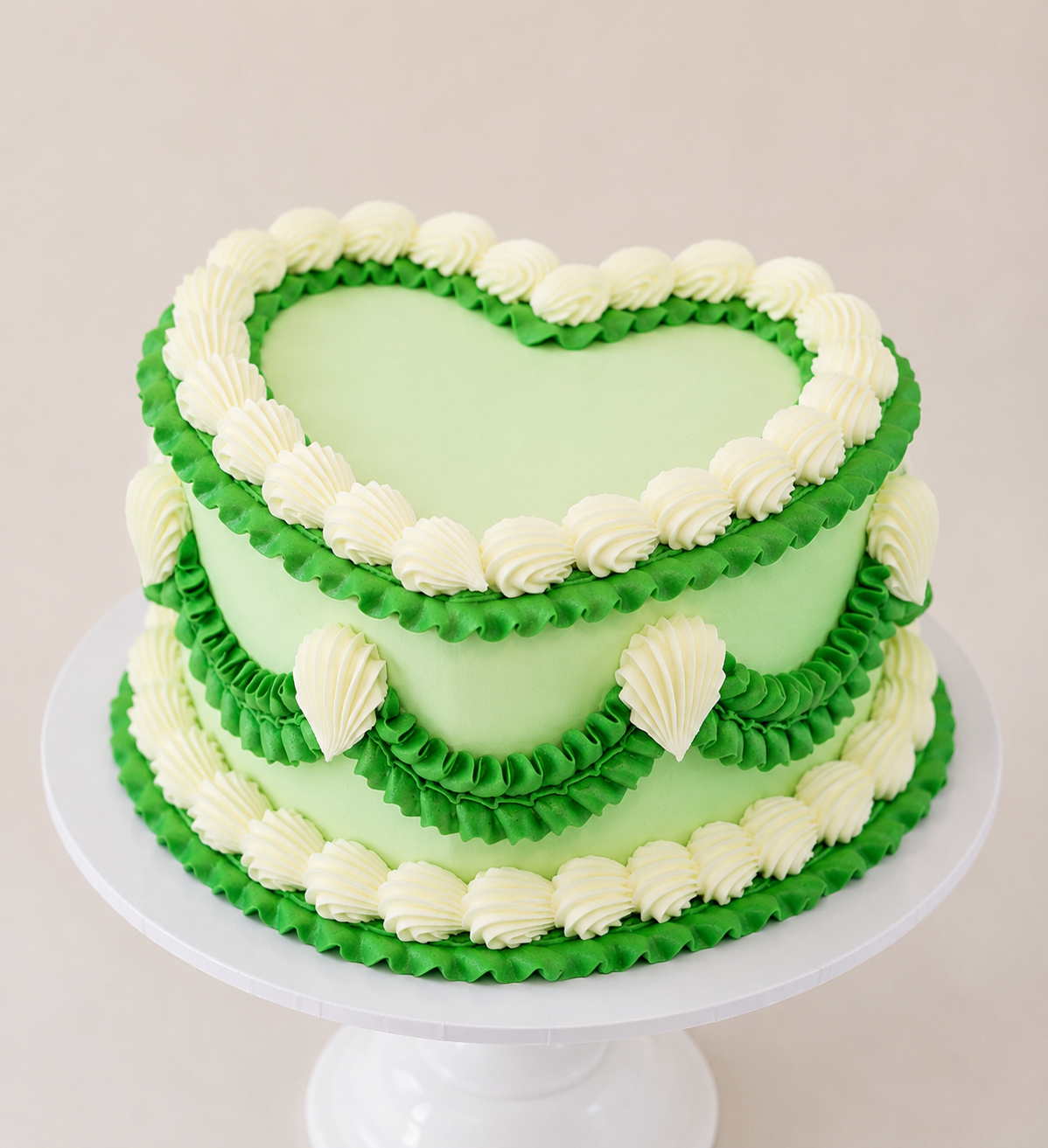 green and white lambeth piping heart shaped cake delivered in london